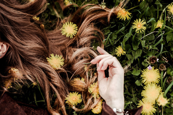 Woman_Brown_Hair_Natural_Colour_On_Grass_With_Flowers