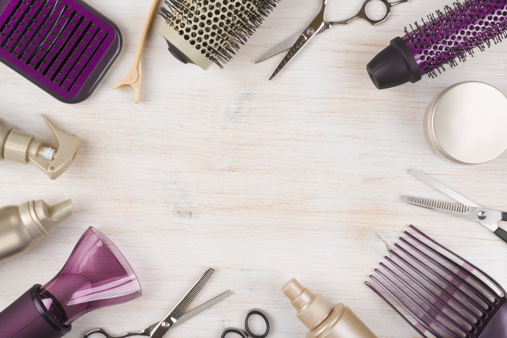 Purple_and_Gold_Hairdresser_Tools_On_Wooden_Background